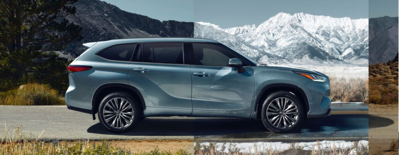 side view of a 2024 Toyota Highlander in front of a mountain range
