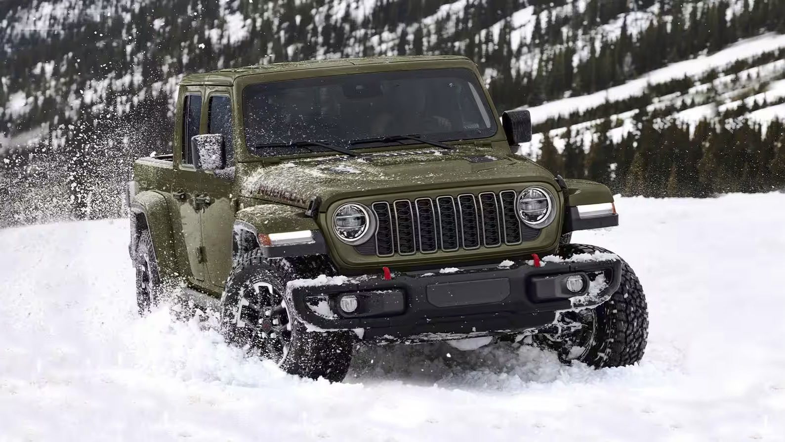 The Jeep Gladiator 2025 driving through deep snow with ease.