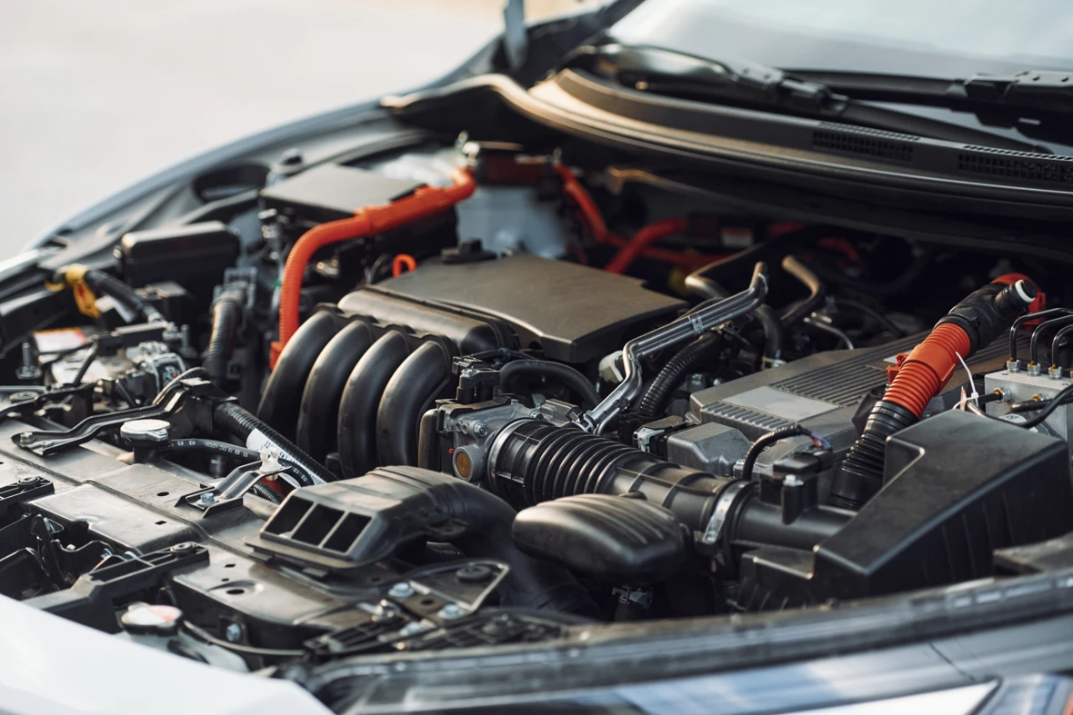 Components under the hood of a hybrid car.