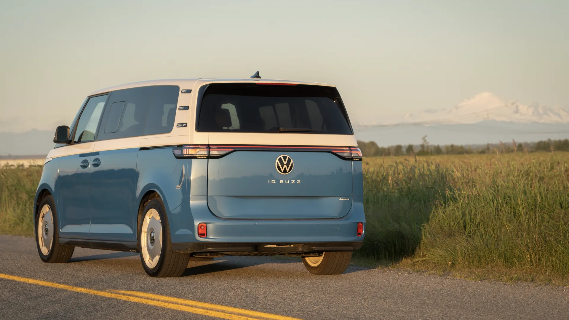 Volkswagen ID. Buzz seen from behind on the road in the early morning