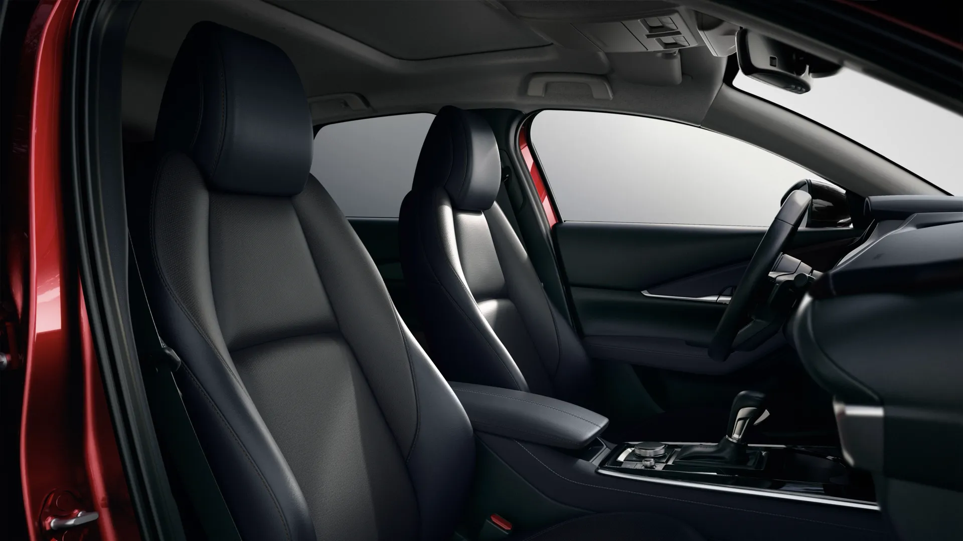 Sièges avant noirs dans l'habitacle du Mazda CX-30 2026