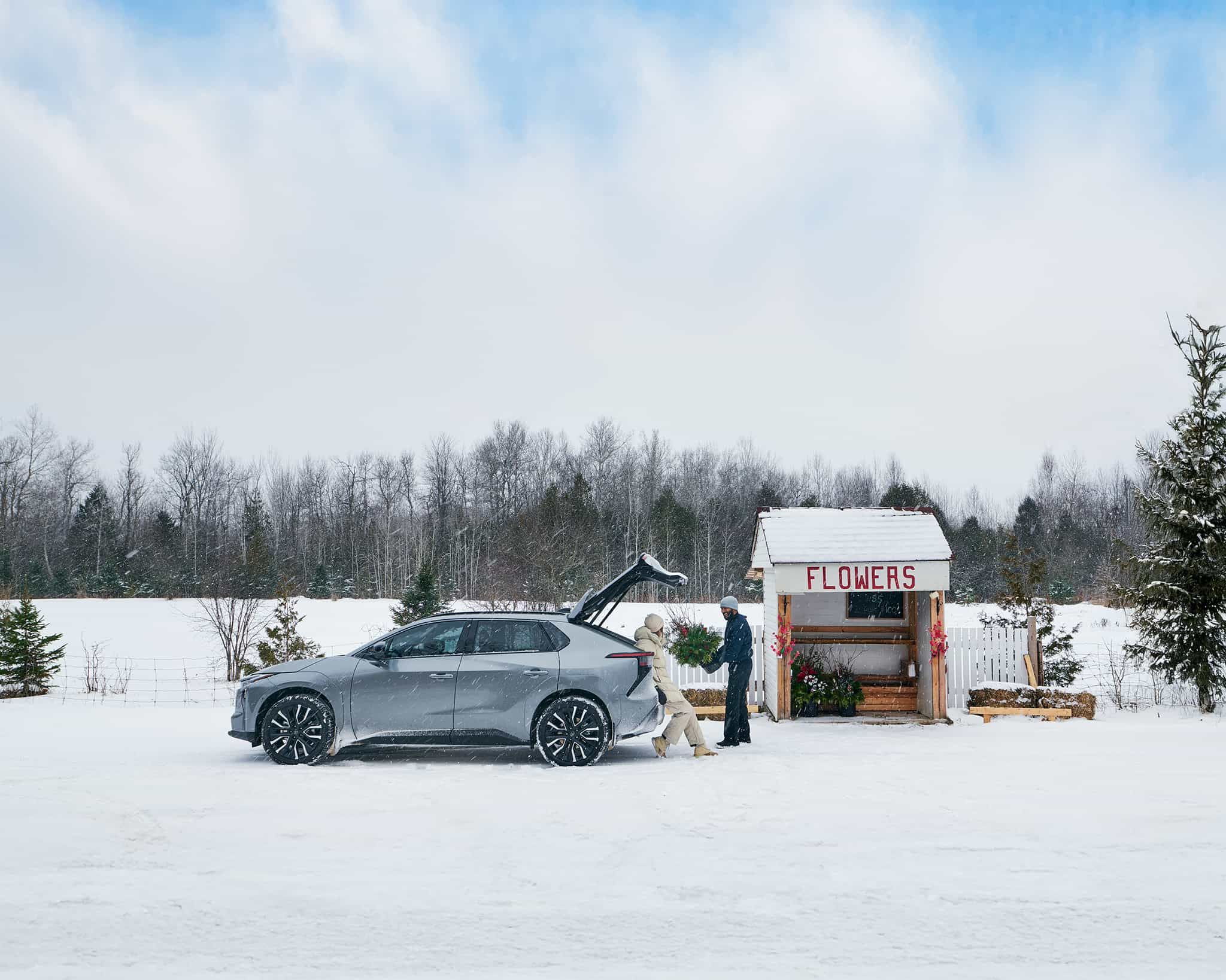 View from inside a car's driver's seat while driving through a tunnel at night, showing light trails.