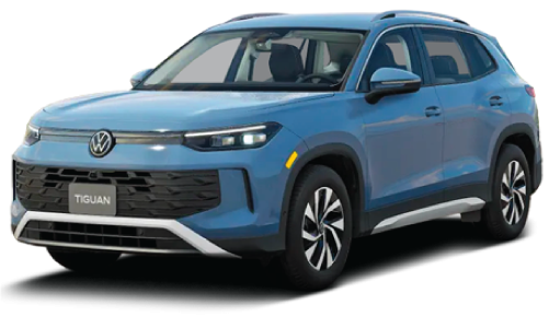 A light blue Volkswagen Tiguan SUV showing the updated front grille and headlight design.