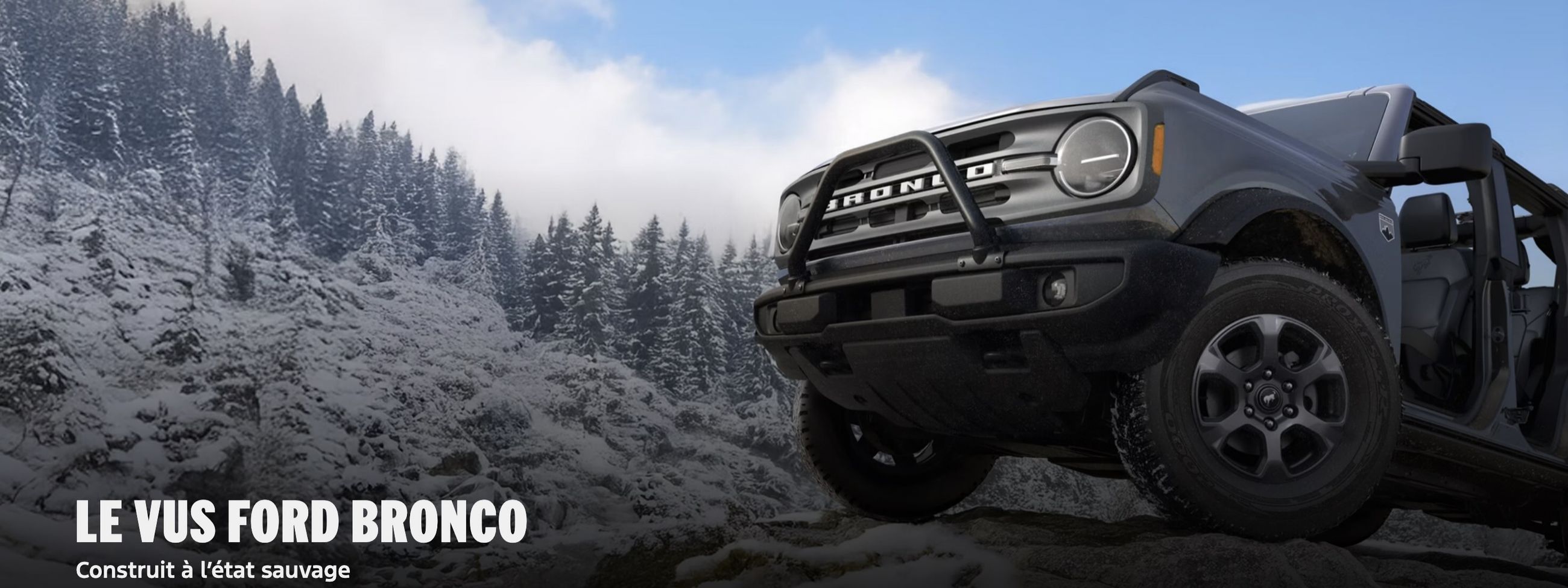 Row of new cars in a dealership showroom, with a red car in the foreground.