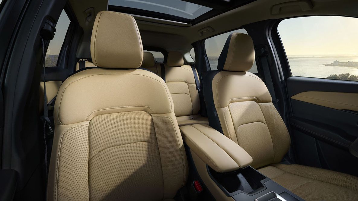 Aerial view of three cars on a winding road, demonstrating active safety and distance sensors.