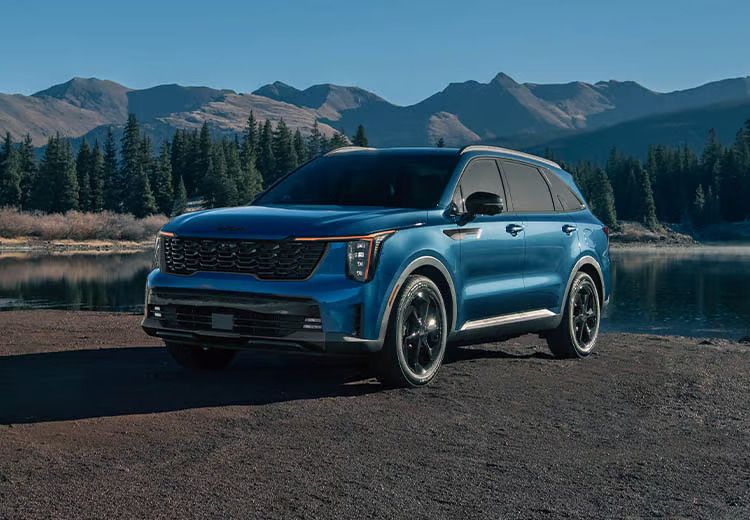 Aerial view of three cars on a winding road, demonstrating active safety and distance sensors.