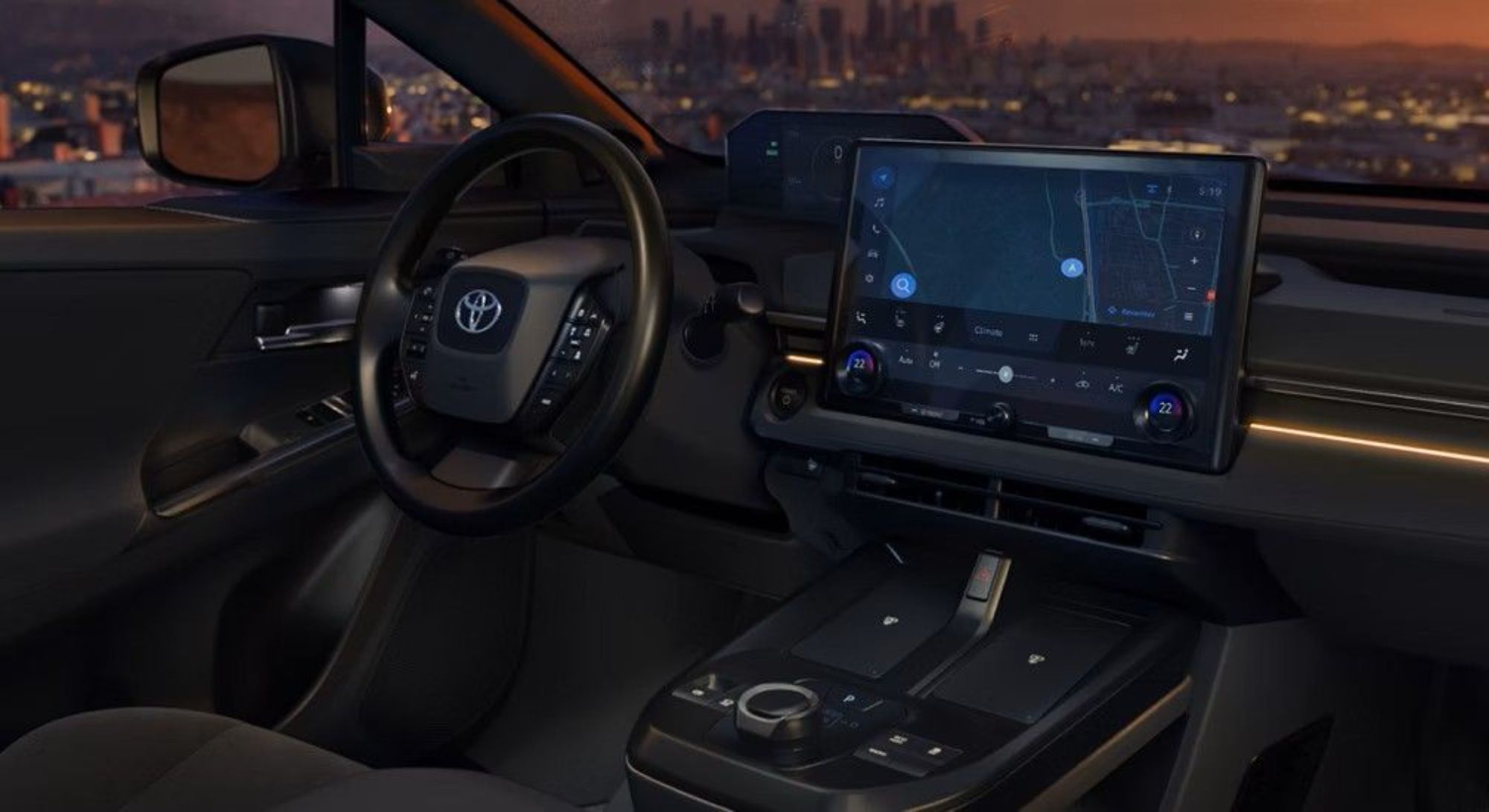 A smiling woman stands in a car dealership, looking at her smartphone while holding a takeaway coffee cup.