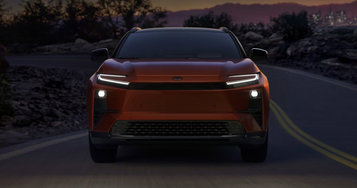Overhead view of many cars in various colors, parked in three organized rows on a white background.