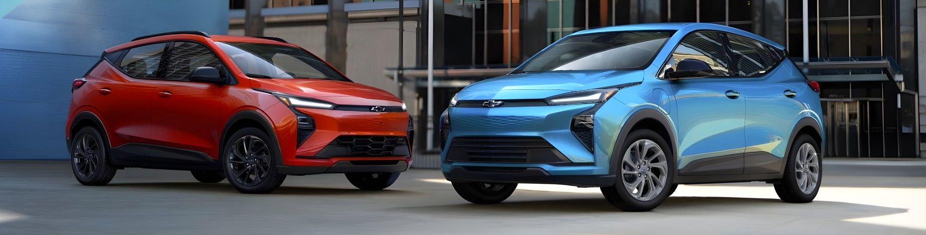 A smiling female salesperson and a male customer look at a clipboard together inside a bright car dealership showroom.