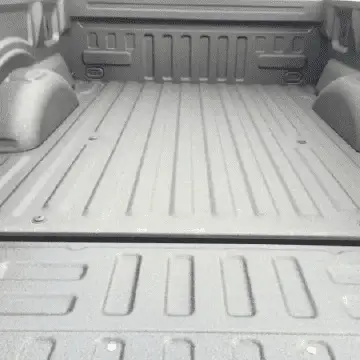 Clear view of a pickup truck bed with a protective spray-on bedliner.