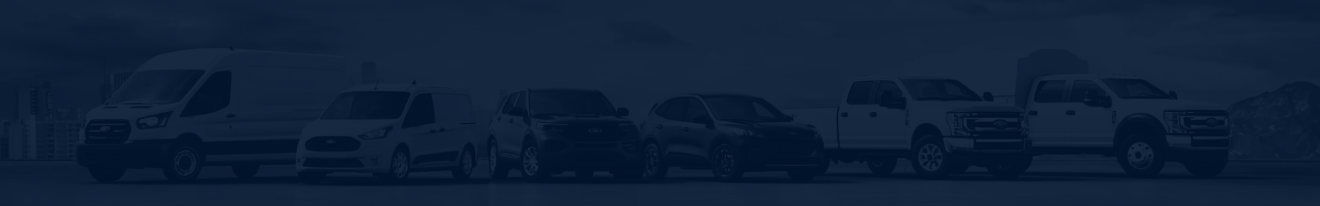 Dark blue tinted banner featuring a lineup of Ford commercial and consumer vehicles, including cargo vans, SUVs, and pickup trucks.