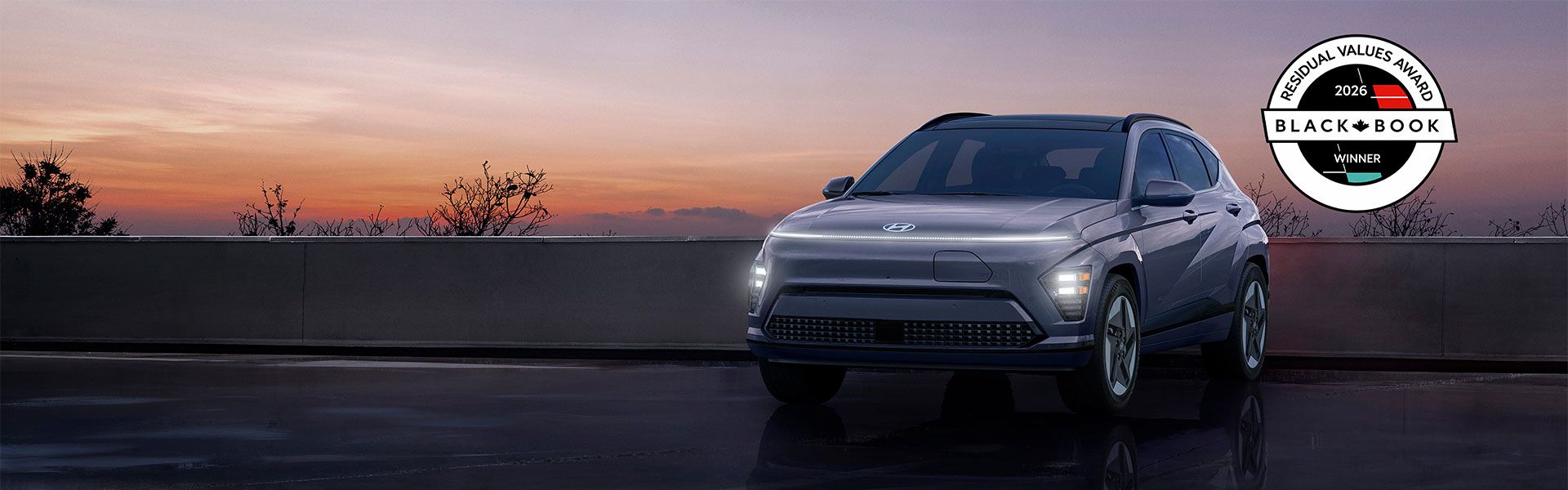 A white sedan speeds down a road, with blue motion blur effects.