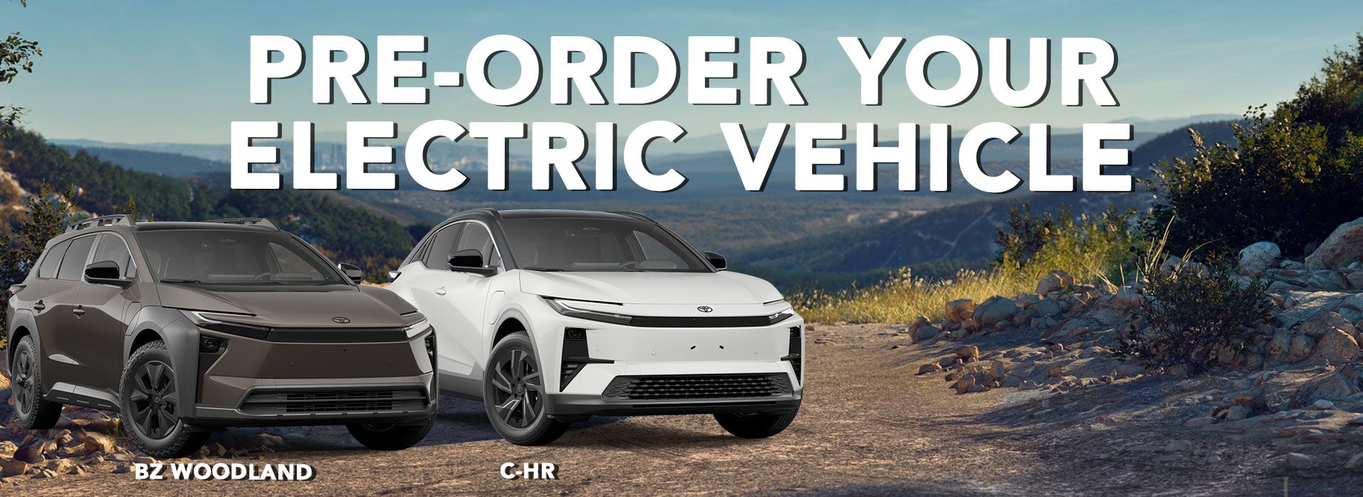 A smiling female salesperson and a male customer look at a clipboard together inside a bright car dealership showroom.