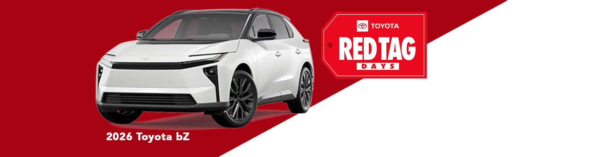 Side view of a white Toyota bZ electric SUV connected to a charger at an outdoor charging point.