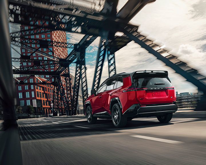 Overhead view of many cars in various colors, parked in three organized rows on a white background.