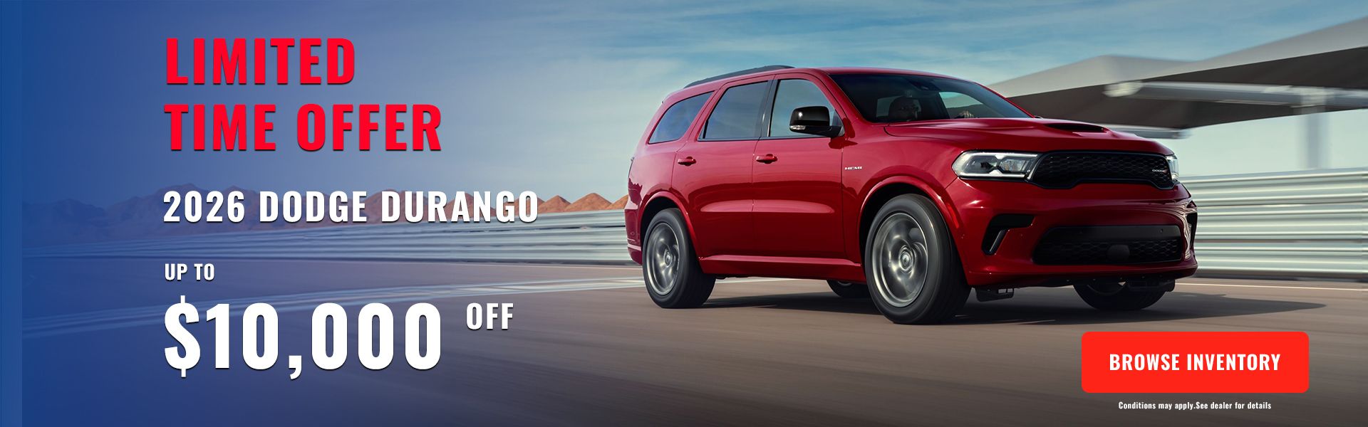 Red 2026 Dodge Durango SUV speeding along a racetrack.