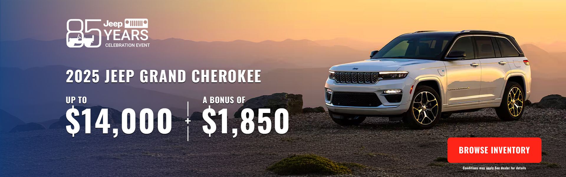 White 2025 Jeep Grand Cherokee SUV parked on a mountain peak at sunset.