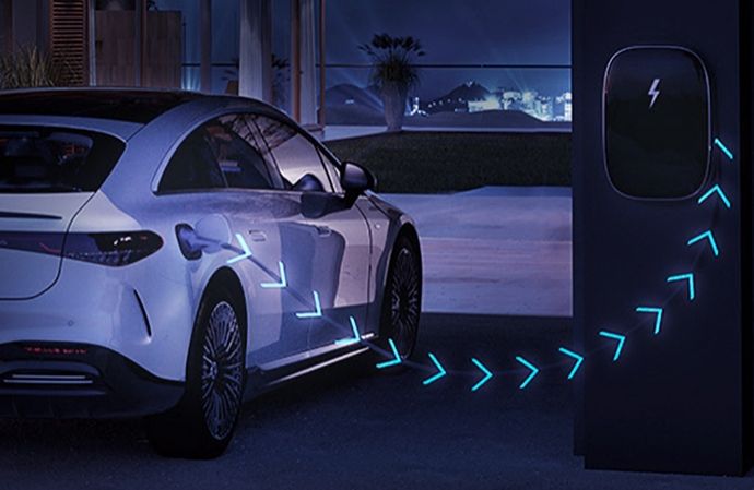 White electric Mercedes-Benz charging with glowing arrows illustrating energy flow