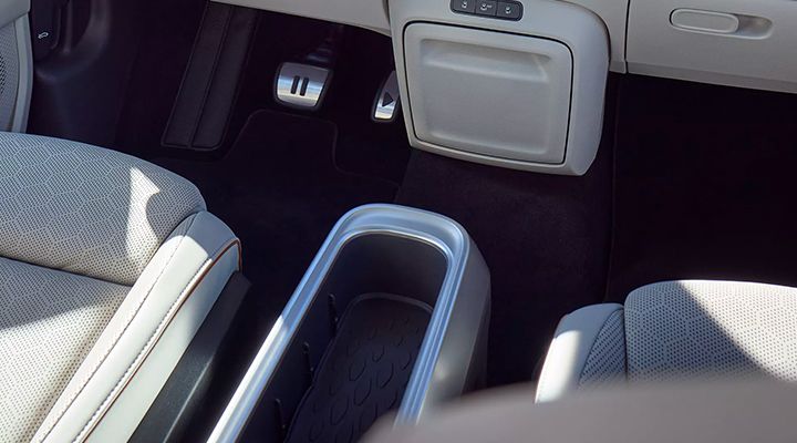 Interior view of a car, showing the removable "Buzz Box" center console between the front seats.