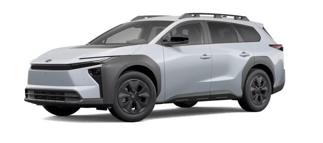 A metallic grey Toyota bZ4X equipped with roof rails, isolated on a white background.