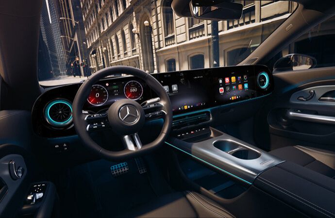Digital dashboard of a Mercedes-Benz with panoramic screen and sport steering wheel