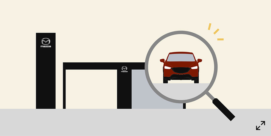 An illustration of a Mazda dealership entrance with a large magnifying glass focused on a red car, symbolizing the search and inspection process when choosing a new vehicle.
