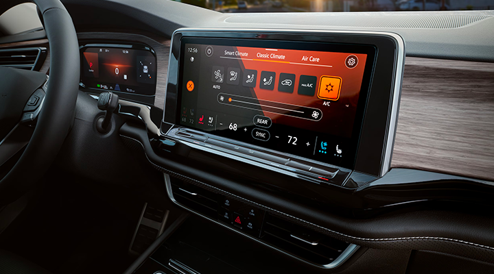 Close-up of the infotainment touchscreen displaying the Climate Control interface (Smart Climate) with AC and seat icons.