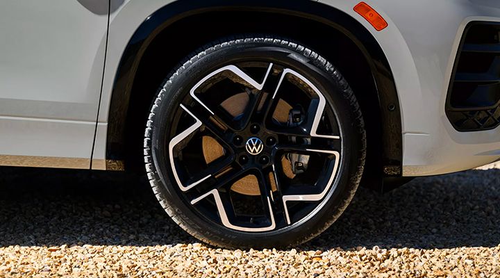 Close-up of a black and silver two-tone alloy wheel on the Volkswagen SUV, showing part of the wheel well and tire.