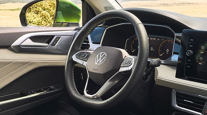 Close-up of the standard heated leatherette steering wheel in the 2026 Volkswagen Taos.