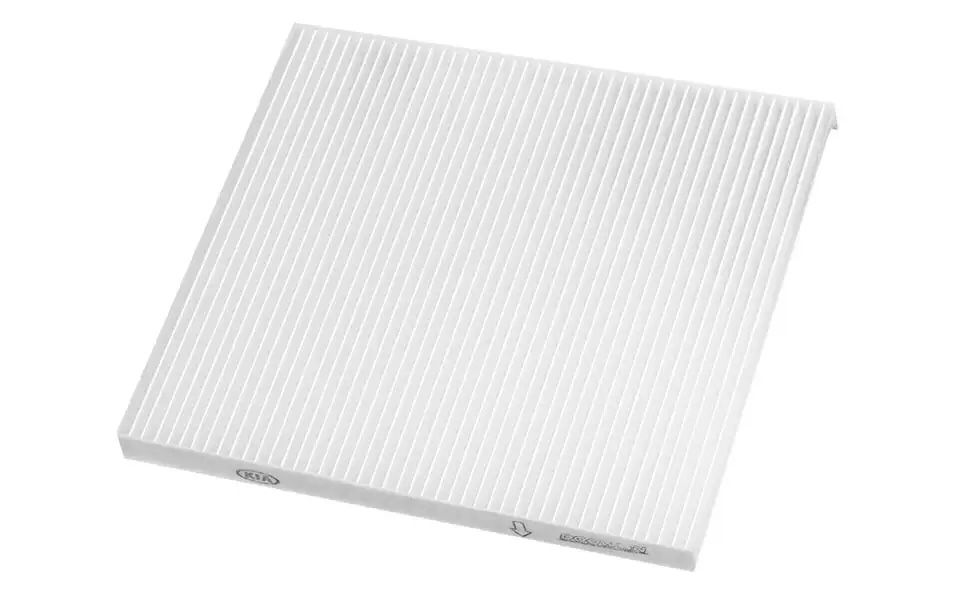 A new, rectangular Kia cabin air filter with white pleated media, shown on a white background.
