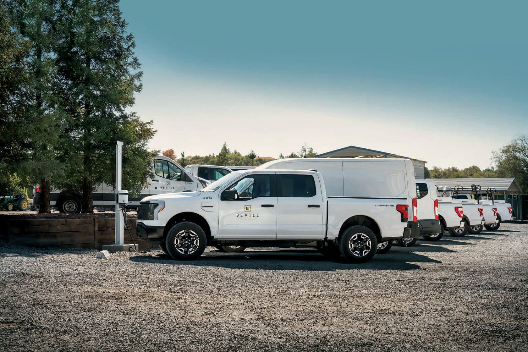 Couples at a public charging station charging a 2022 Mustang® Mach-E and F150 Lightning®