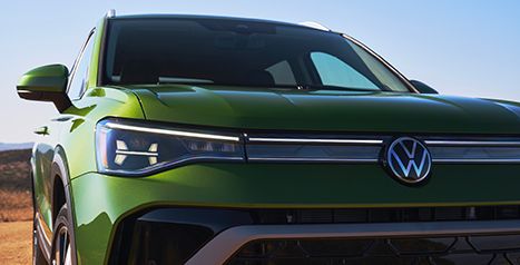 Front detail view of the 2026 Volkswagen Taos in green, highlighting one of the available colour options.