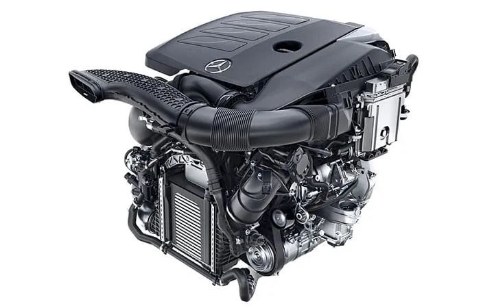 Studio shot of a modern Mercedes-Benz car engine isolated on a white background.