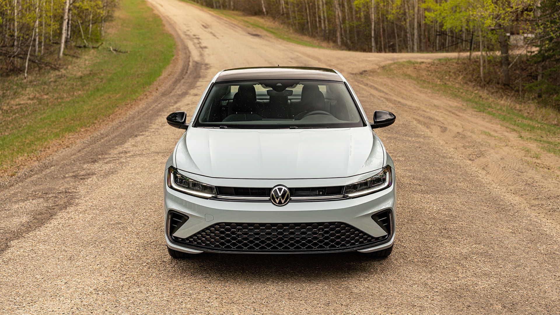 2027 Volkswagen Jetta front view showcasing bold grille, LED headlights and aggressive fascia design