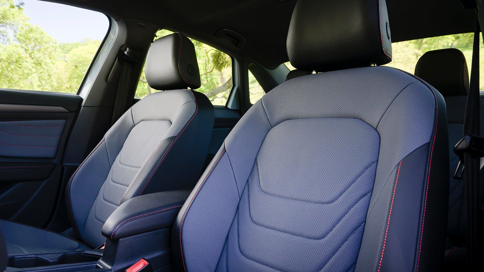 Jetta GLI front sport seat with leatherette trim and red contrast stitching.