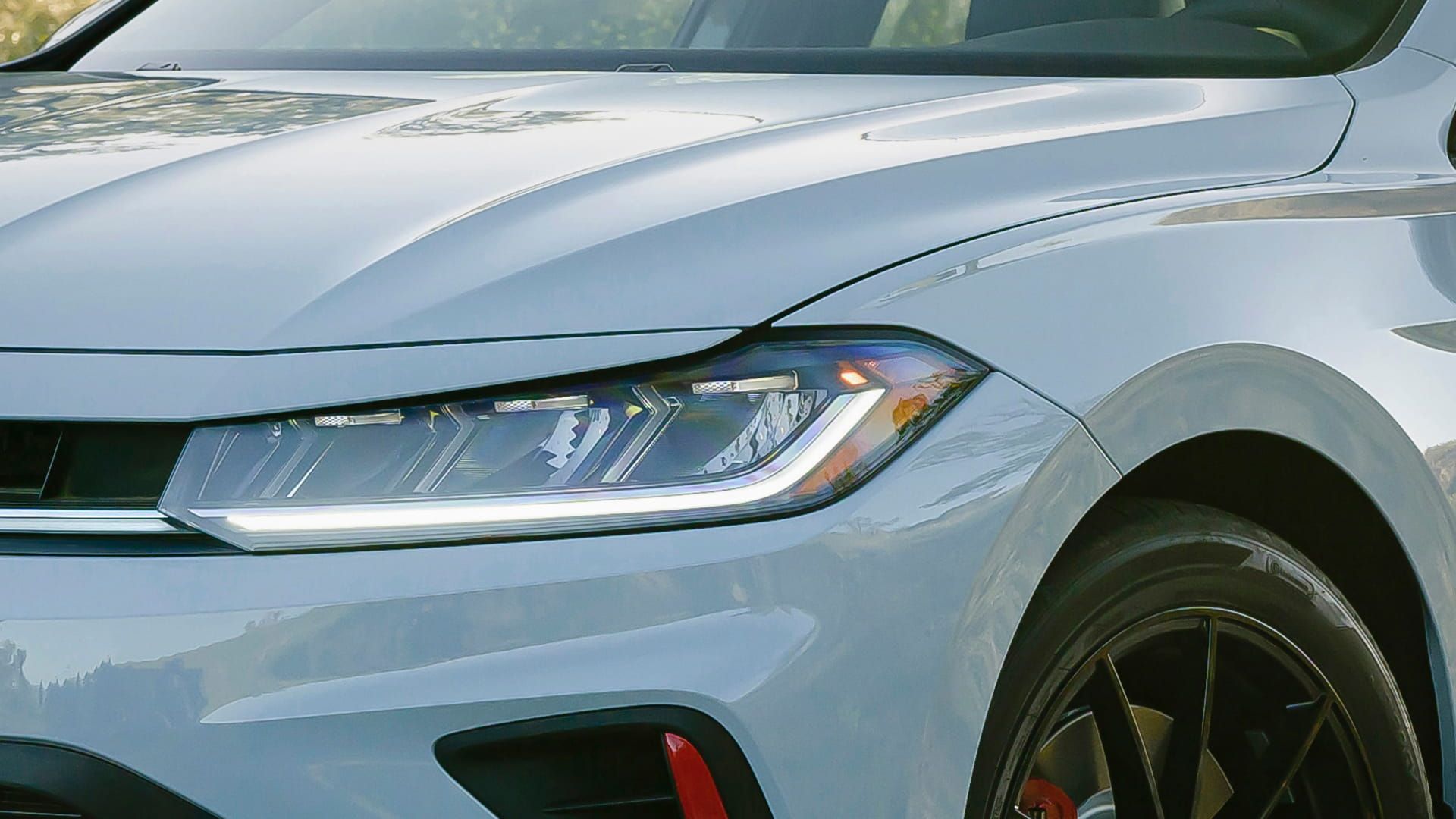 Close-up of Jetta GLI LED headlight with sharp lines and sporty front styling.