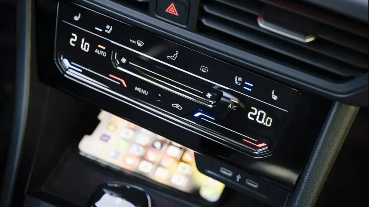 Dual-zone climate controls in the Jetta GLI center console with digital temperature display.