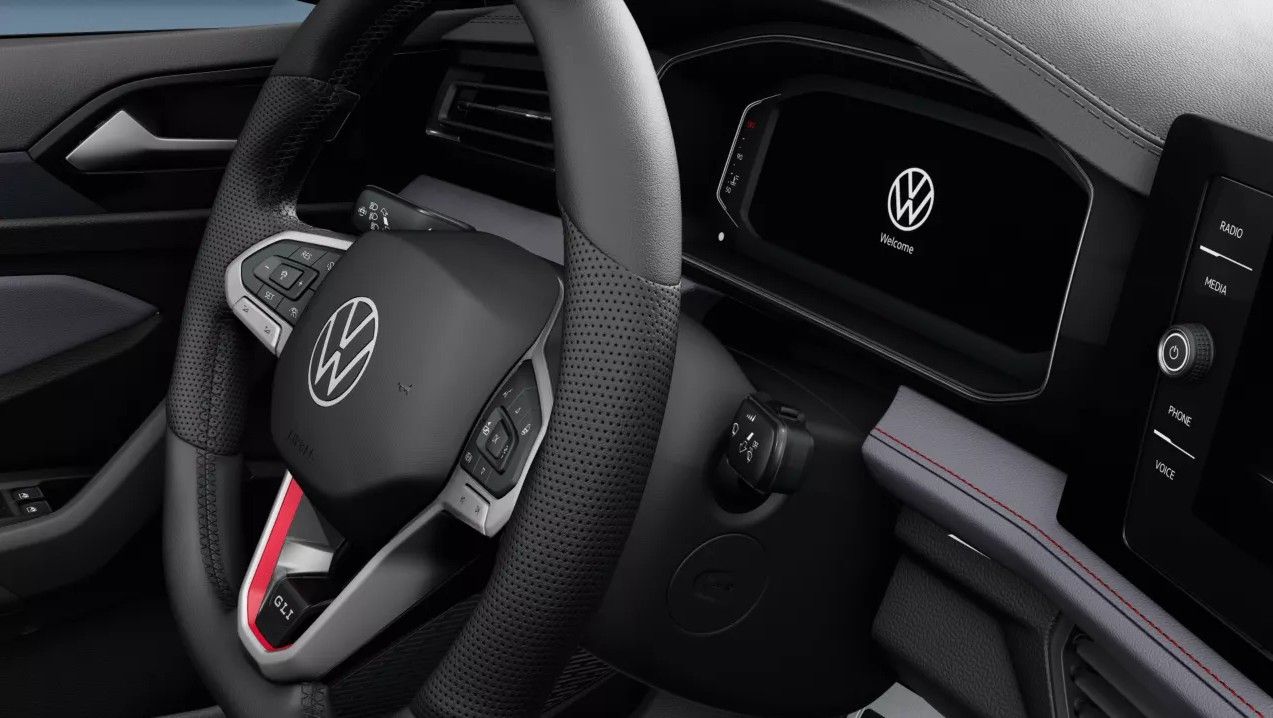 Leather-wrapped sport steering wheel in the Jetta GLI with GLI badge and red accents.
