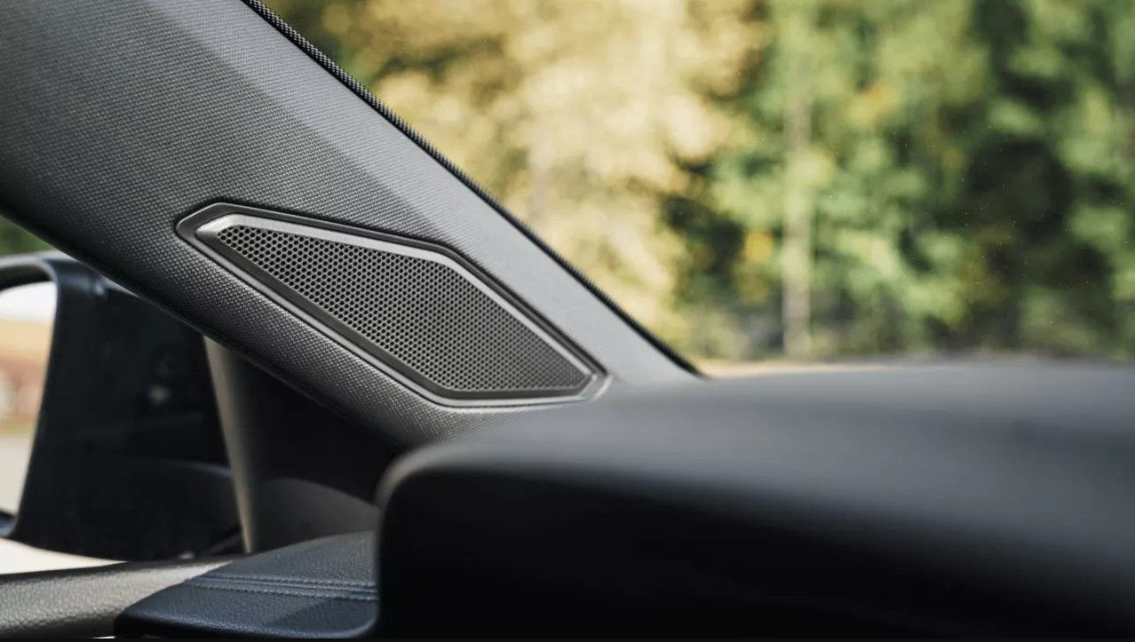 Premium speaker integrated into the Jetta GLI A-pillar near the windshield.