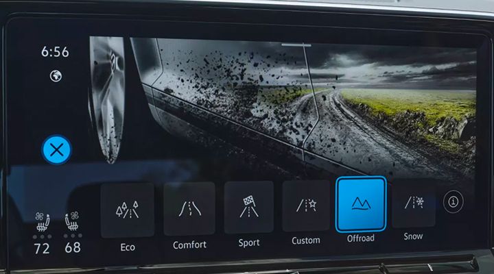 Vehicle infotainment screen displaying driving modes ("Eco", "Comfort", "Sport", "Custom", "Offroad", "Snow"), with "Offroad" mode selected.
