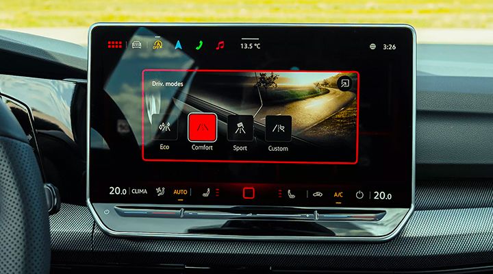 Close-up on the Golf GTI's infotainment screen, displaying the driving modes with "Comfort" mode selected.