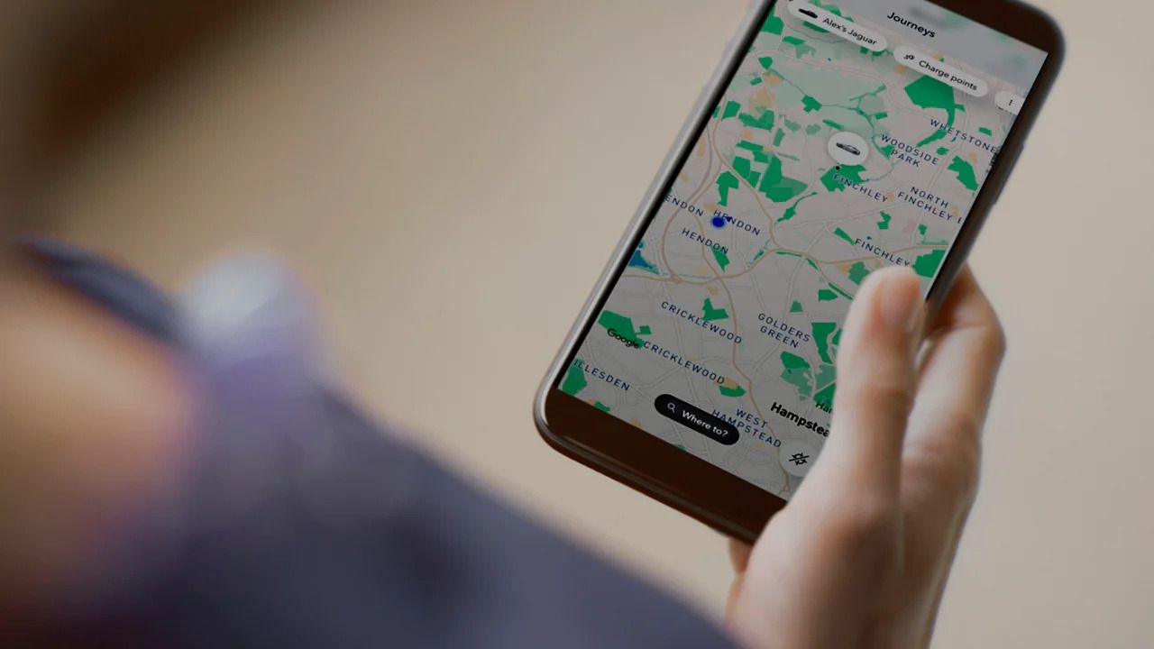 Close-up of a smartphone displaying an interactive map with electric charging points.