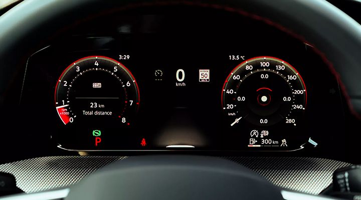 Digital instrument cluster of a Golf GTI displaying the tachometer, speedometer, trip odometer, and various vehicle information.