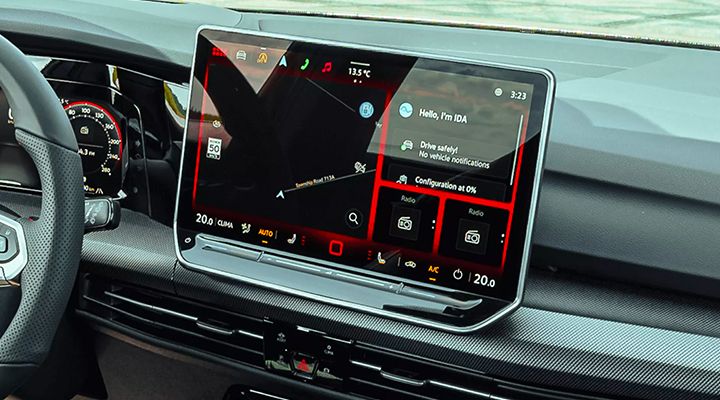 Central infotainment screen of the Golf GTI showing navigation, the "Hello, I'm IDA" voice assistant prompt, and radio shortcuts.