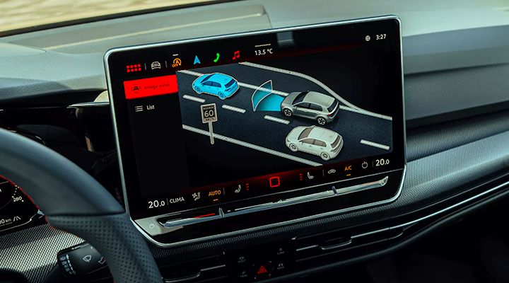 Golf GTI infotainment screen displaying the driver assistance system (Travel Assist), illustrating vehicles on the highway.