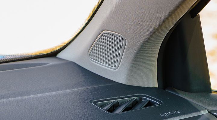 Close-up of speaker grille and rear tray inside the 2026 Volkswagen Taos, representing the new VW premium audio system.