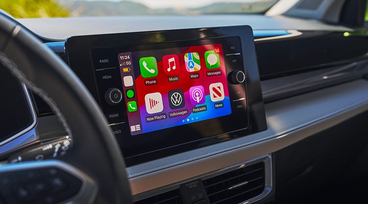 Touchscreen in the 2026 Volkswagen Taos displaying Apple CarPlay and Android Auto interface.