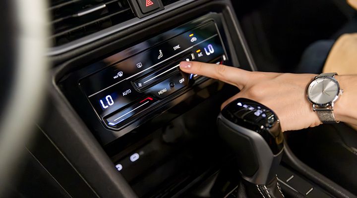 Close-up of the 2026 Volkswagen Taos Climatronic touchscreen climate control panel.