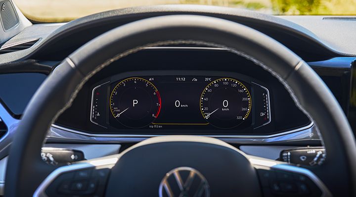 Close-up of the 2026 Volkswagen Taos digital cockpit displaying speedometer and driving data.