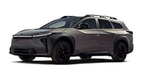 A metallic grey Toyota bZ4X equipped with roof rails, isolated on a white background.